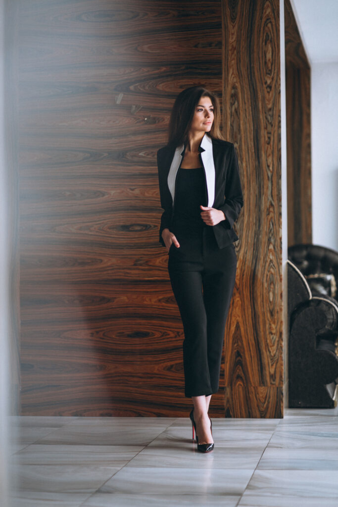 Structured fabrics, like tailored suits, blazers, and dresses